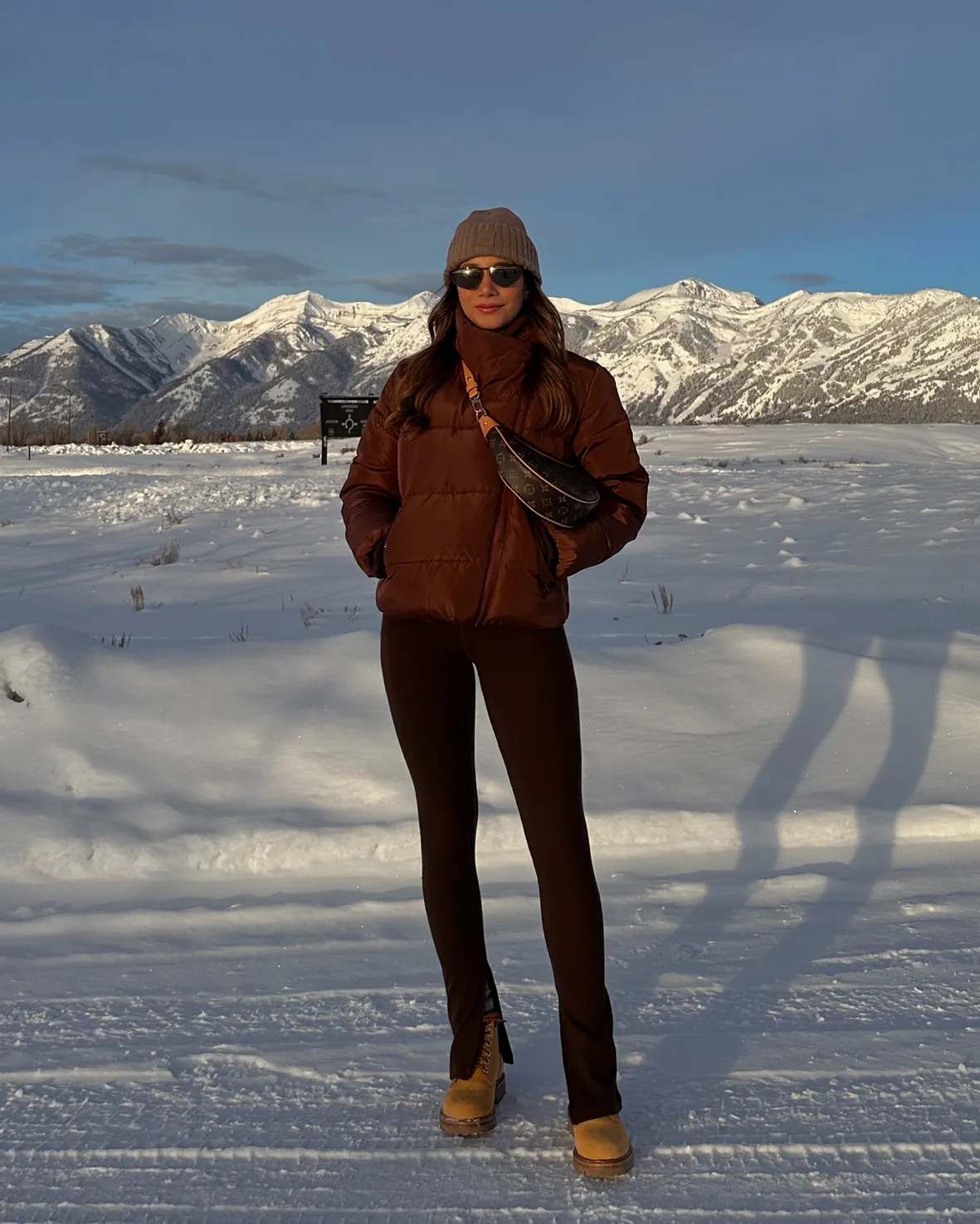 Brown Puffer Jacket and Tan Boots for a Chic Hike — Winter Hiking Outfits