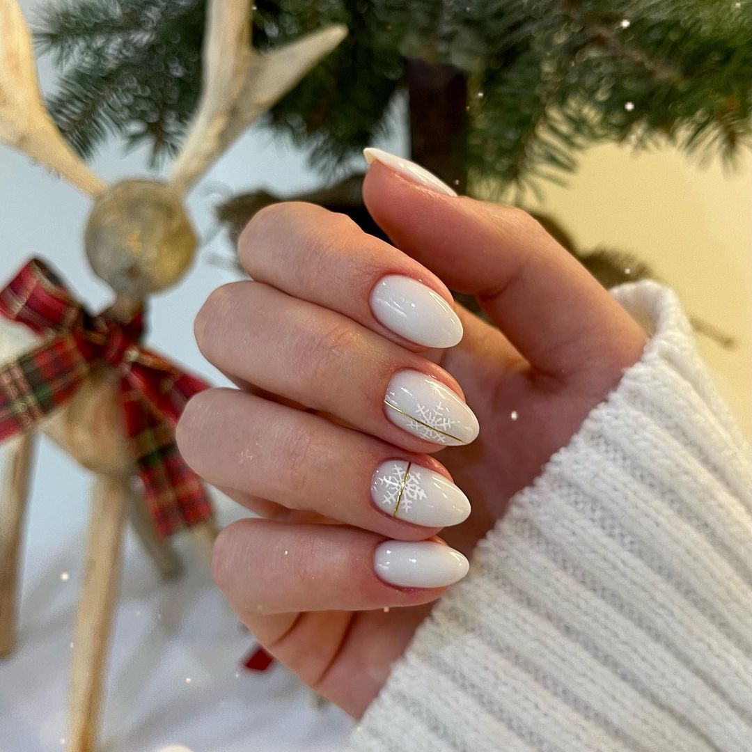 Opaque White Gold Snowflake Almond Nails Opaque White Gold Snowflake Almond Nails — Winter Vacation Nails