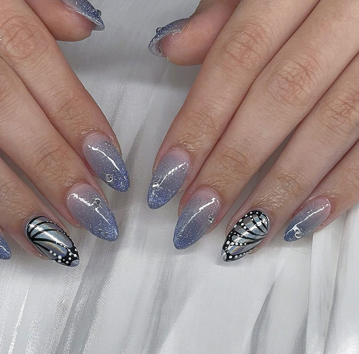 Blue Glitter Gradient with Butterfly Wings Blue Glitter Gradient with Butterfly Wings — Trendy Almond Nail Designs