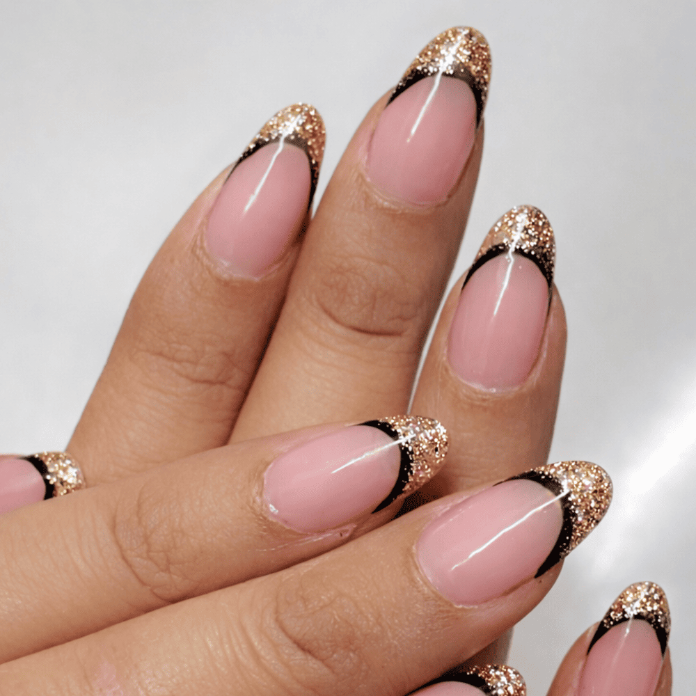 Sheer Pink with Gold Glitter French Tips Sheer Pink with Gold Glitter French Tips — Trendy Almond Nail Designs