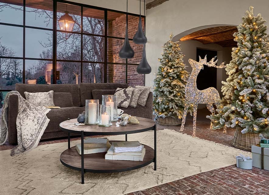 Inviting Farmhouse Living Area with Twinkling Christmas Trees and Reindeer — Farmhouse Christmas Decor