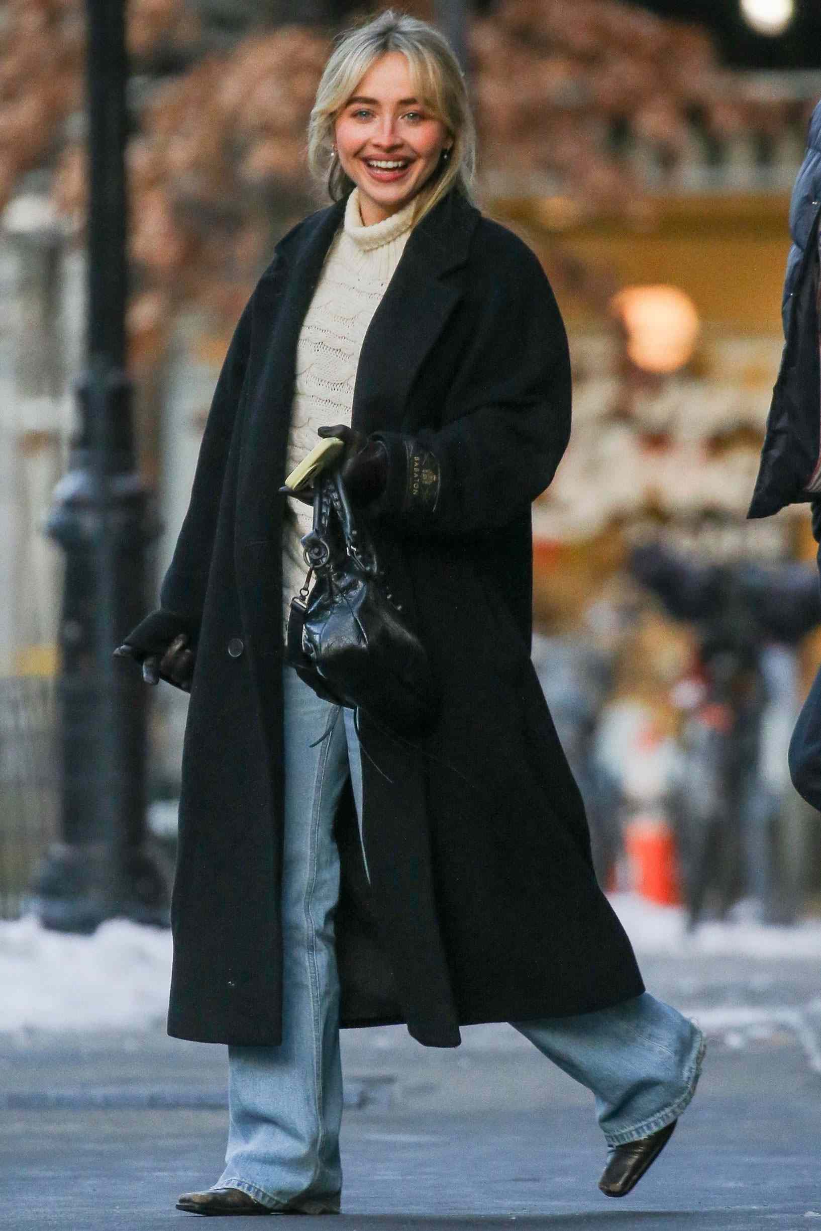 Cream Cable Knit Sweater with Black Wool Coat for Winter Warmth — Winter Dinner Outfits