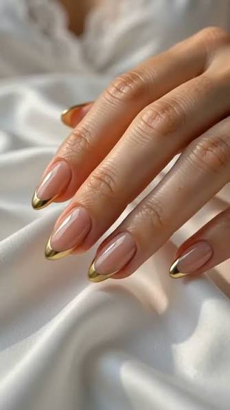 Nude Base with Metallic Gold French Tips — trendy almond nail designs
