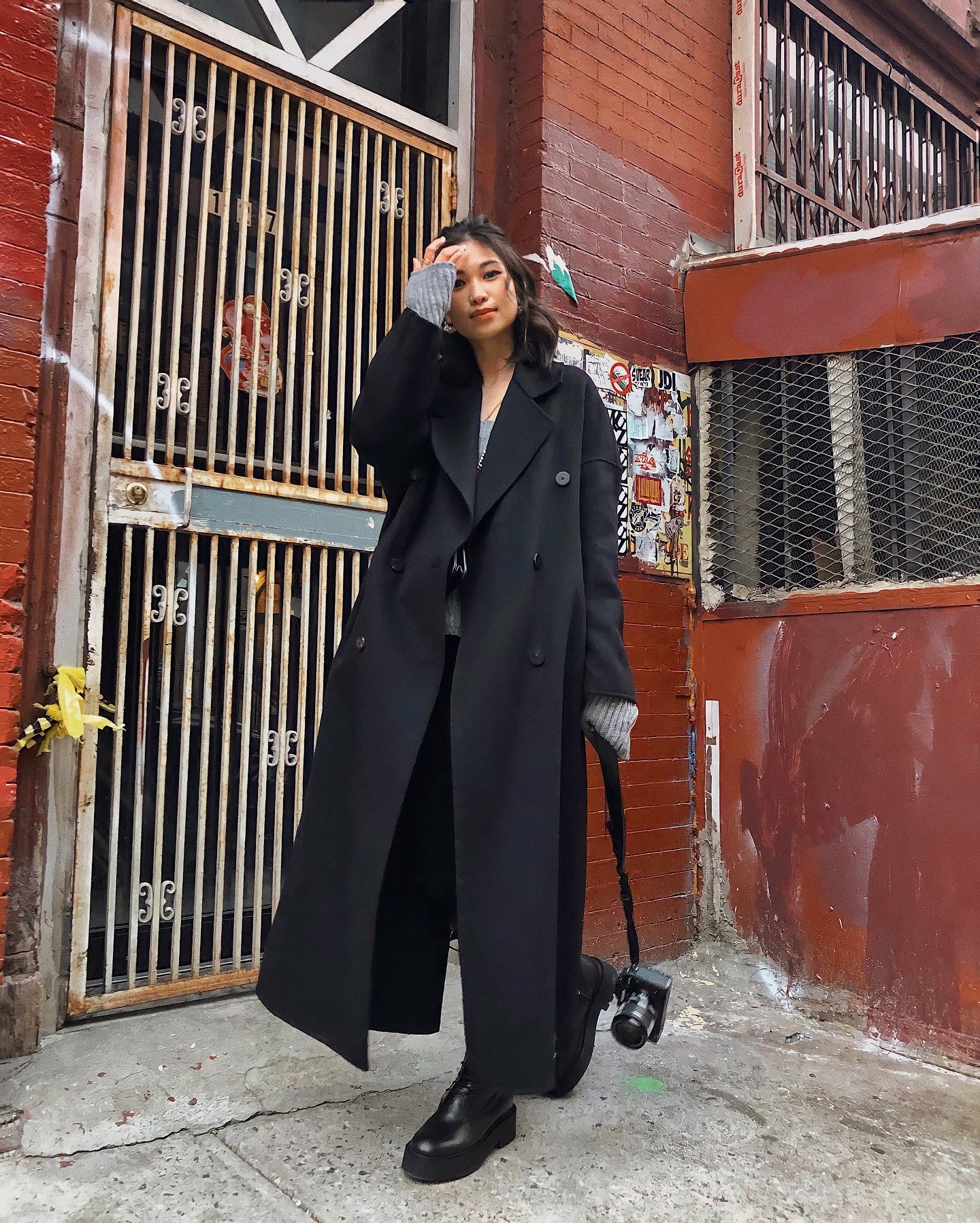 Urban Edge: Black Long Coat with Knit Sleeves and Platform Shoes Urban Edge: Black Long Coat with Knit Sleeves and Platform Shoes — Long Coat Outfits