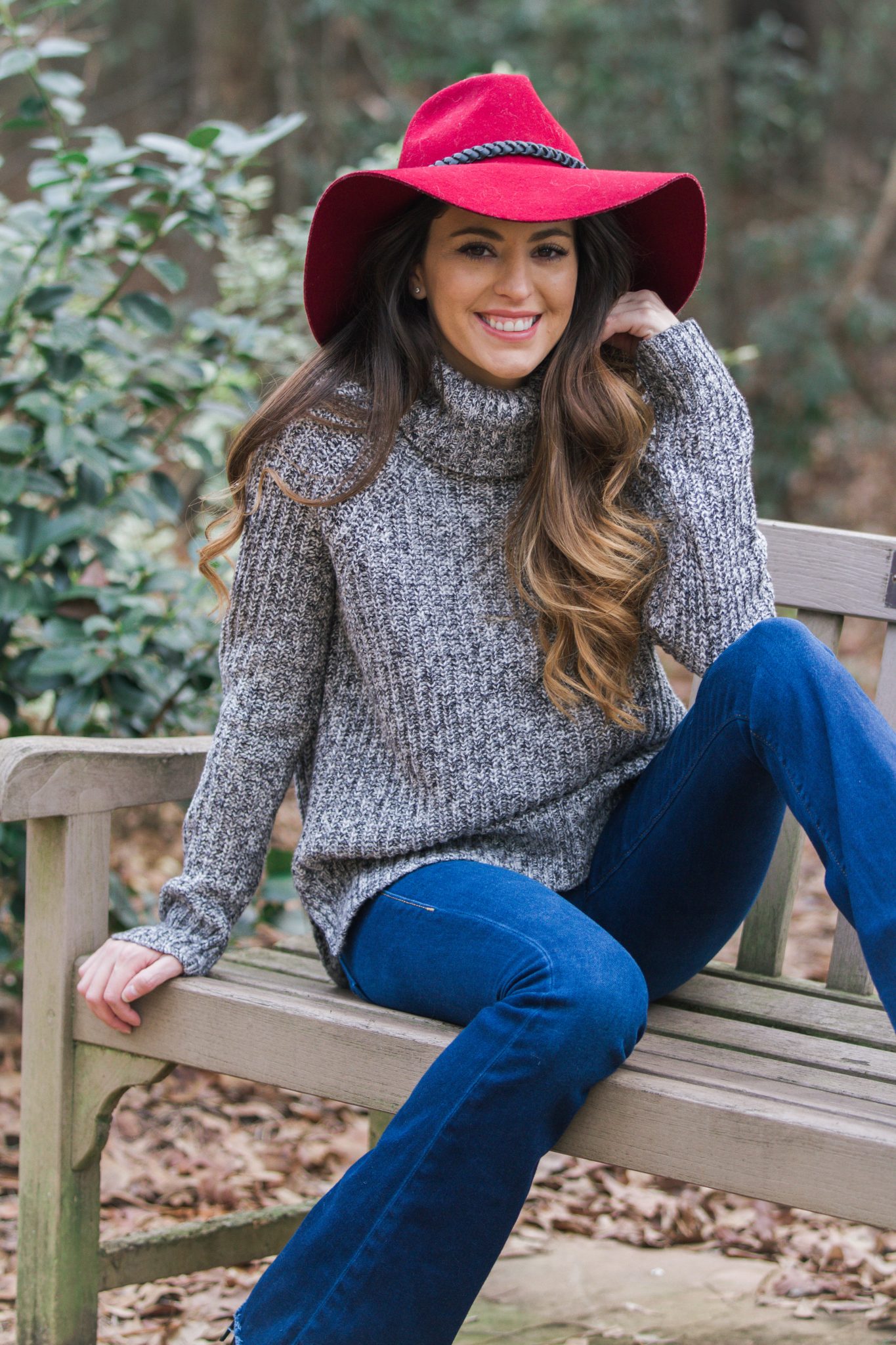 Cozy Knit and Flare Jeans: Grey Sweater with Red Hat Accent — Comfy Winter Outfits