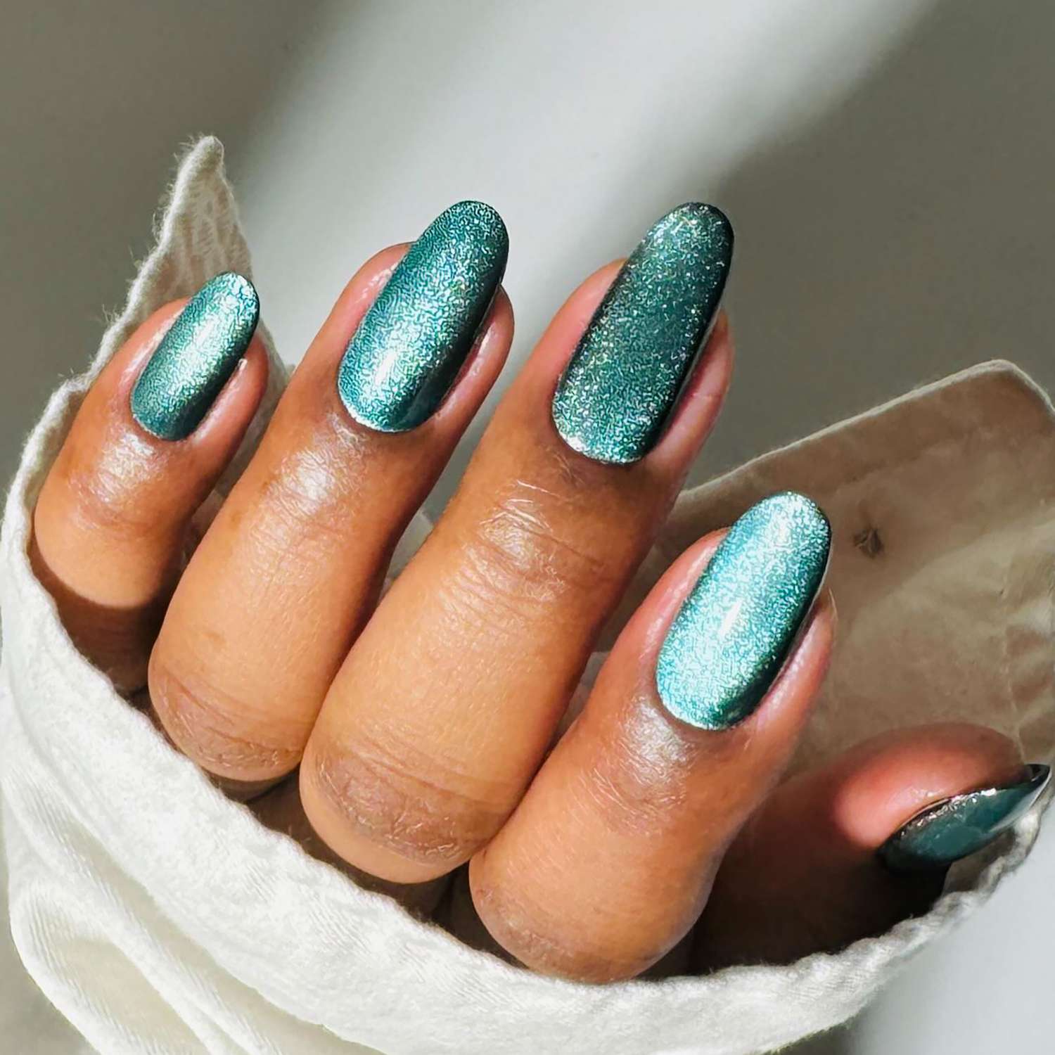 Medium Oval Shimmering Teal Nails Medium Oval Shimmering Teal Nails — Winter Nail Colors for Women Over 60