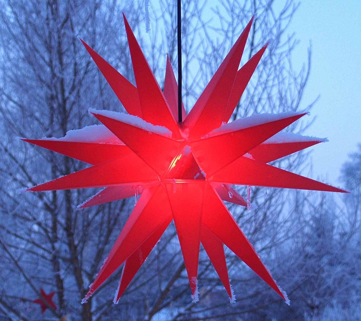Hang a Red LED Star Lantern in Winter Scenery Hang a Red LED Star Lantern in Winter Scenery — Simple Christmas Outdoor Decor