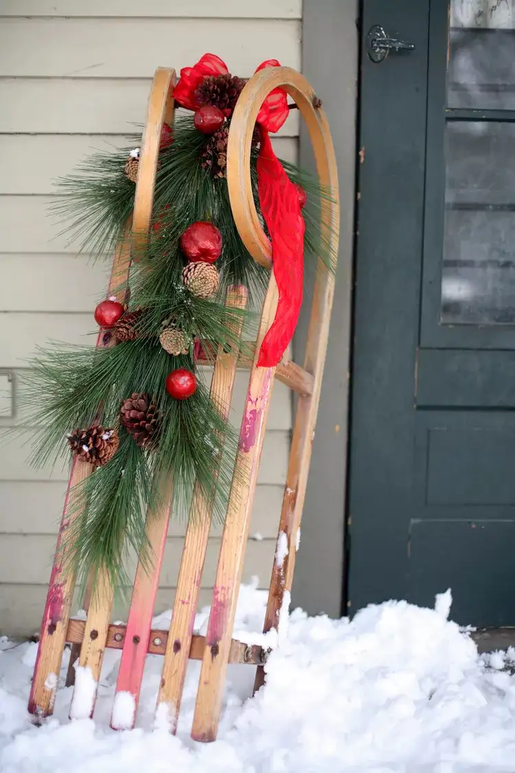 Decorate a Vintage Sled with a Pine Garland Decorate a Vintage Sled with a Pine Garland — Simple Christmas Outdoor Decor