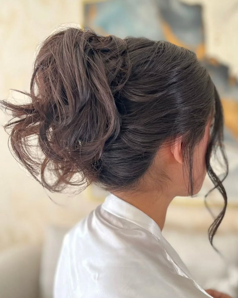 Voluminous Dark Brown Updo with Textured Pieces Voluminous Dark Brown Updo with Textured Pieces — Junior Prom Hairstyles 2027