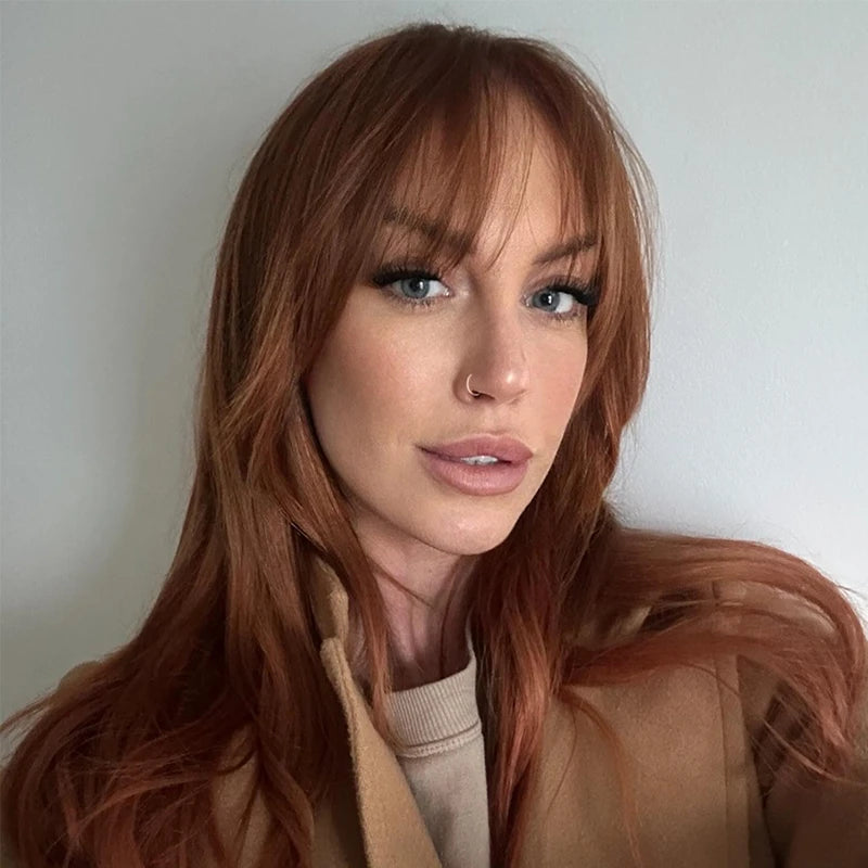 Vibrant Copper Red with Full Bangs — Winter Hair Colors for Pale Skin