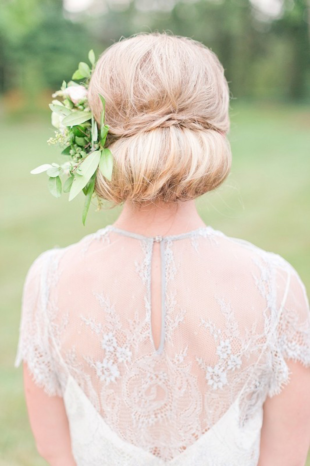 Polished Light Blonde Low Bun With Flowers Polished Light Blonde Low Bun With Flowers — Mother of the Bride Updos 2027